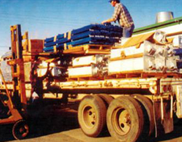 Man Stacking Items for Delivery